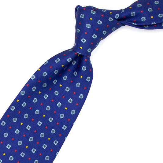 Blue tie with blue flowers and red and yellow crosses