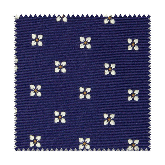 Blue fabric with white flowers and yellow squares