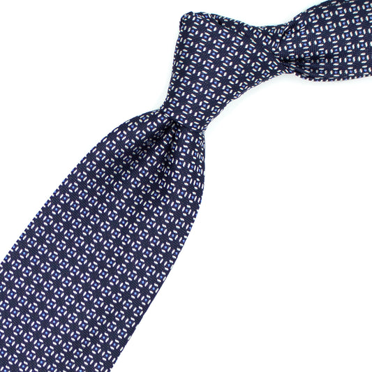 Blue tie with white and light blue geometric pattern