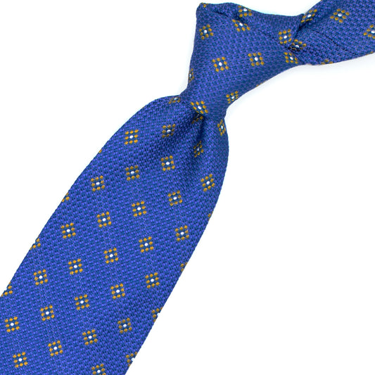 Blue tie with yellow and white geometric pattern