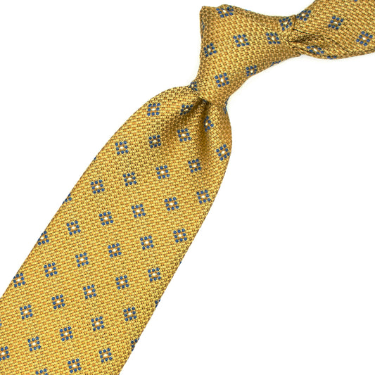 Yellow tie with light blue and white geometric pattern