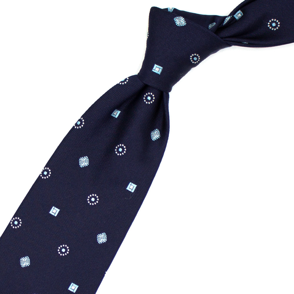 Blue tie with grey and light blue geometric pattern