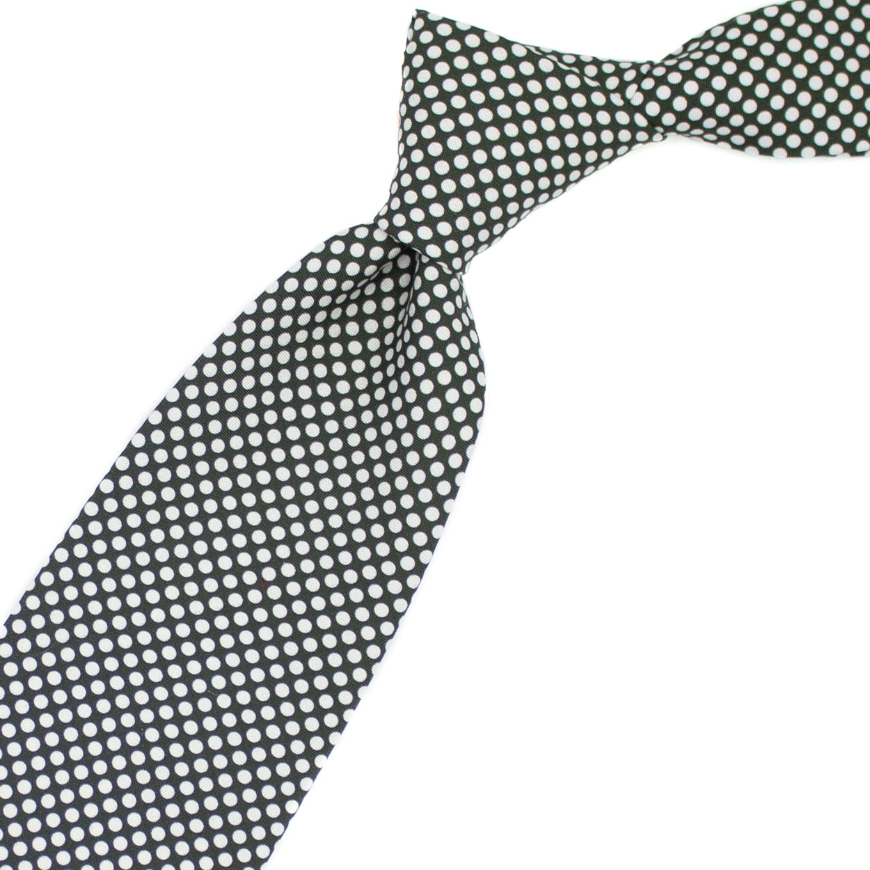 Green tie with white polka dots