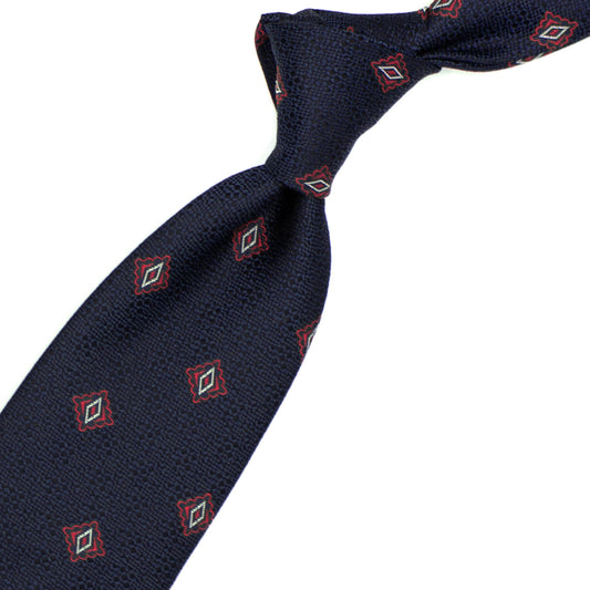 Blue tie with red and white geometric pattern