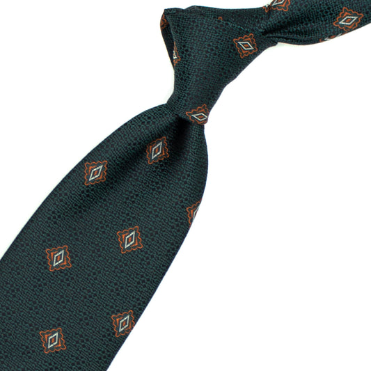 Green tie with orange and white geometric pattern