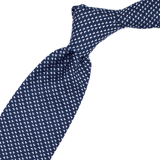 Blue tie with white geometric pattern
