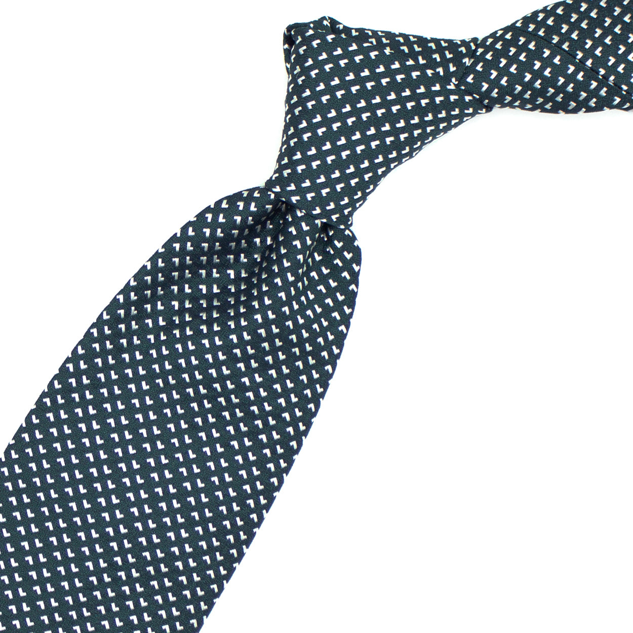 Green tie with white geometric pattern