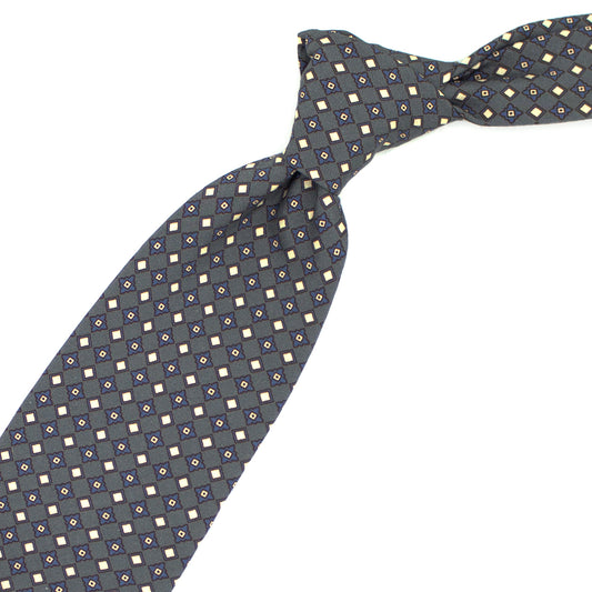 Grey tie with blue and cream geometric pattern