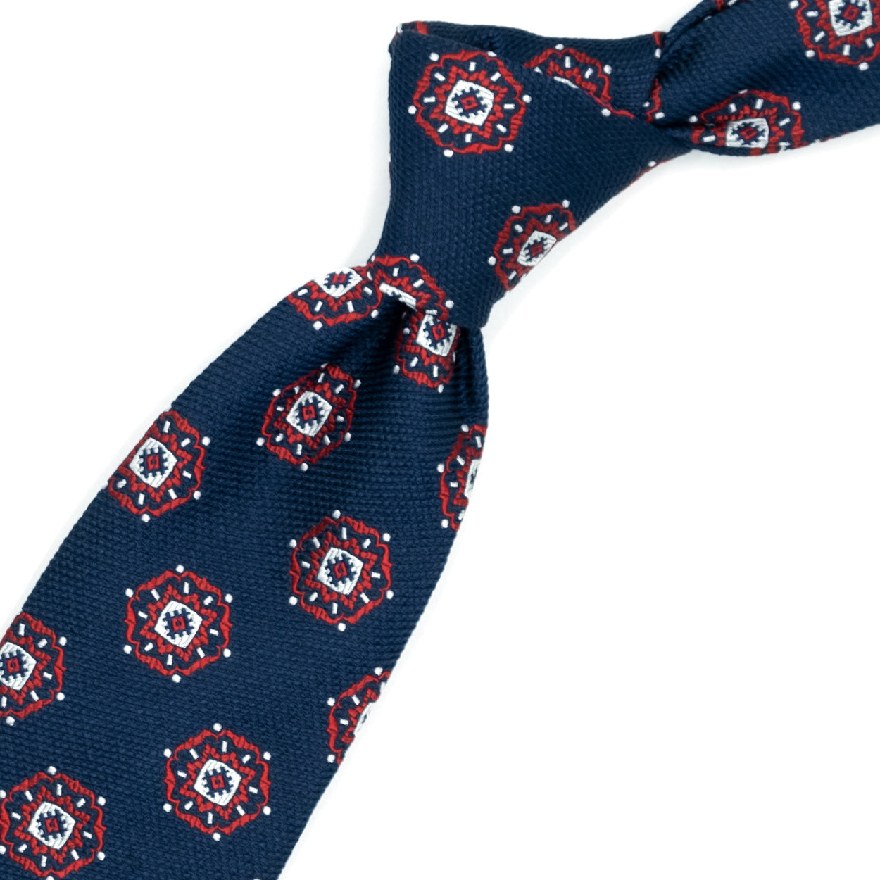 Blue tie with red and white medallions