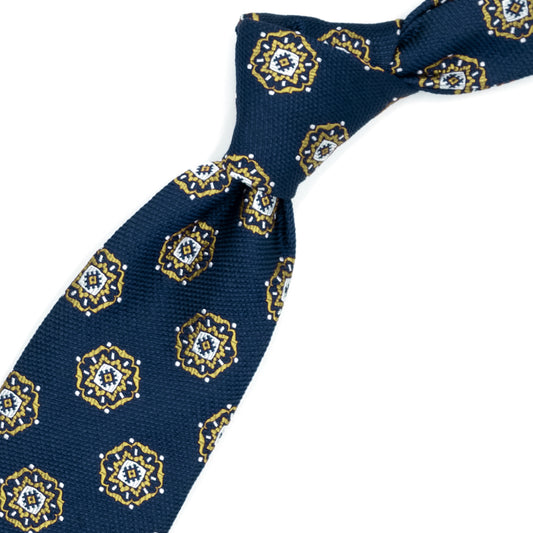 Blue tie with yellow and white medallions