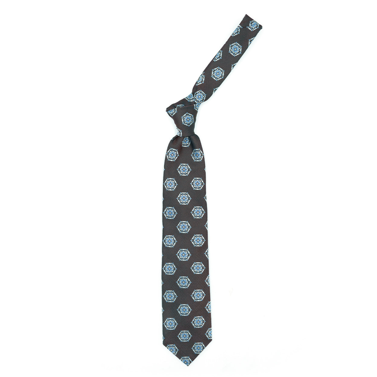 Brown tie with white and blue medallions