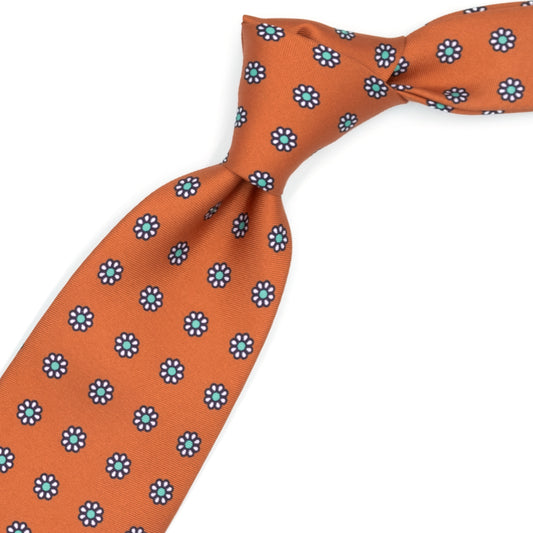 Orange tie with white flowers and teal dots