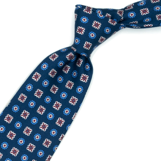Blue tie with red and blue flowers