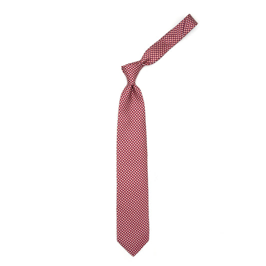 Magenta tie with red and white geometric pattern