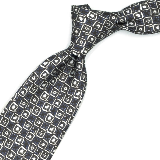 Brown tie with white and blue abstract pattern