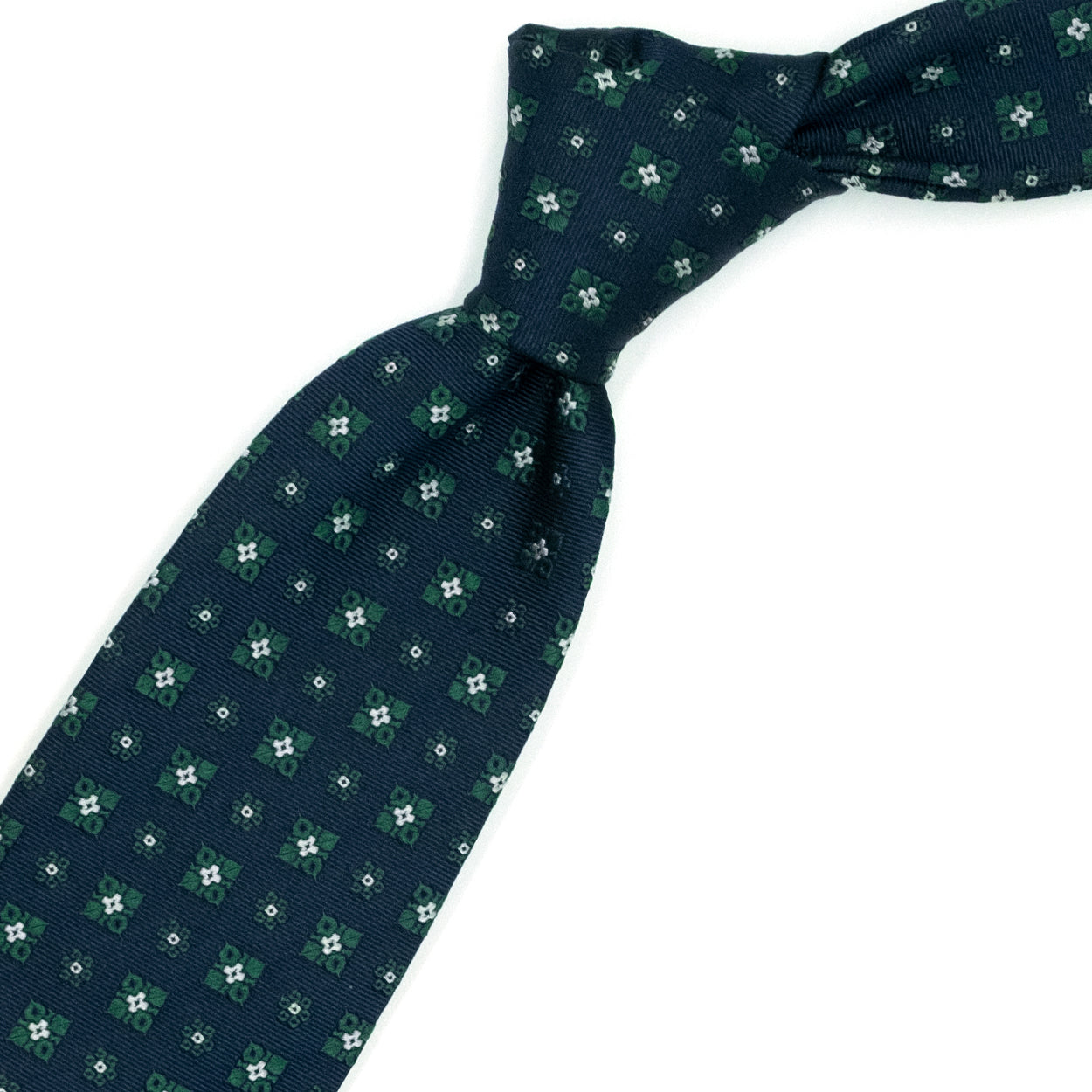 Blue tie with green and white flowers