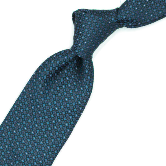 Light blue tie with blue squares and white dots