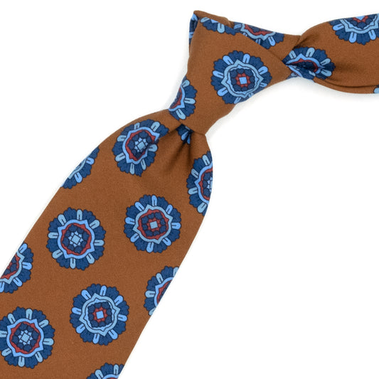 Light brown tie with blue, blue and red medallions