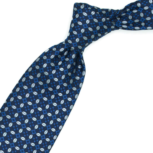 Blue tie with gray ovals and light blue flowers